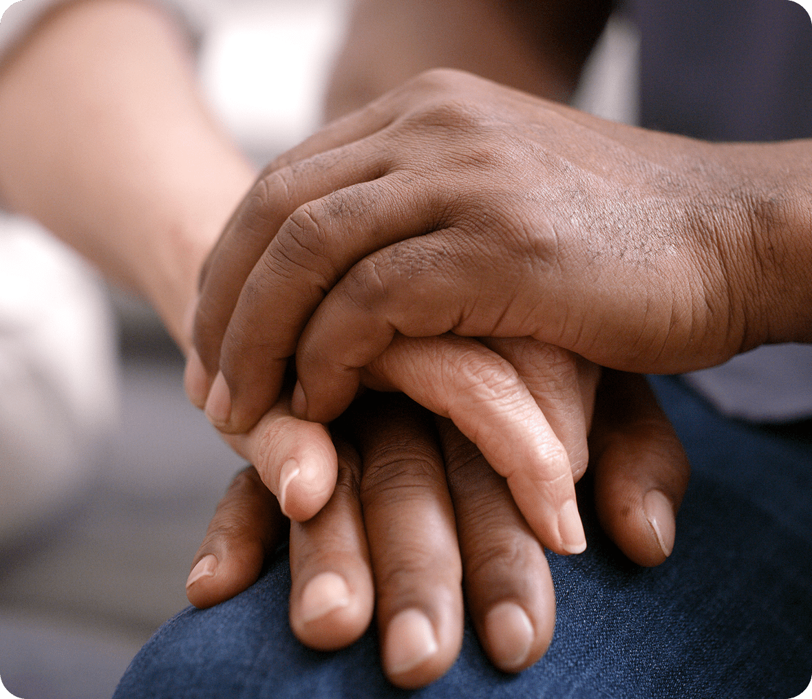 Hands offering comfort and support